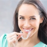 Patient with Custom-Made Clear Invisalign Aligner