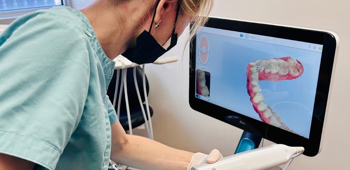 A Premier Smile Center patient smiling after her cosmetic treatment