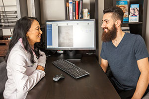 Dr. Johnson speaking with a patient during a consultation.